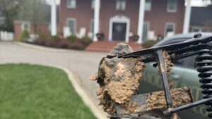 A mole caught in a metal trap held in front of a residential home in Cincinnati, OH.